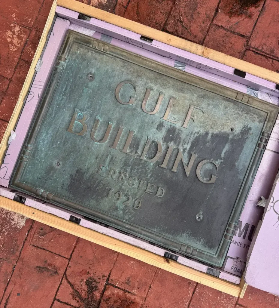 The Gulf Building plaque packed in its wooden shipping crate